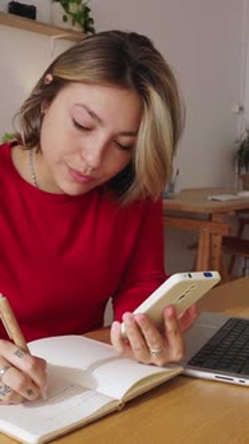 Young Adult Woman Multitasking While Working From Home Office
