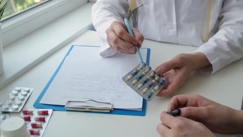 Doctor Explains Medication to Patient at Clinic