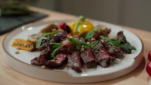 Close Up of Cooked Beef Steak and Grilled Veggies on Plate