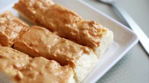 Creamy Peanut Butter Toast on White Plate