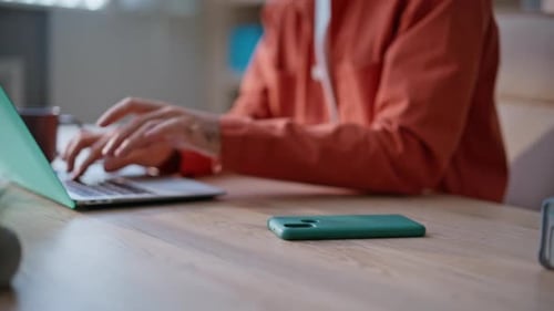 Office Specialist Reading Message with New Job Offer at Modern Workspace Closeup