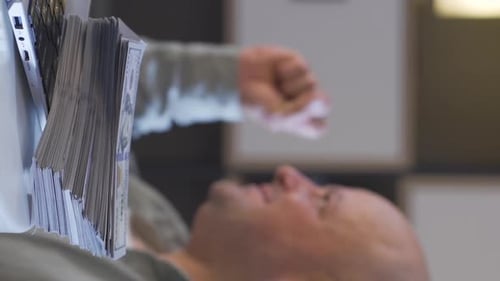 Close Up Man with Laptop and Stack of Money