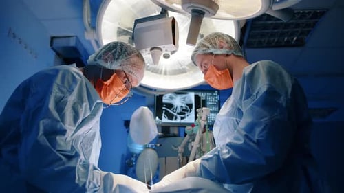 Surgeons Perform Operation in Sterile Hospital Operating Room