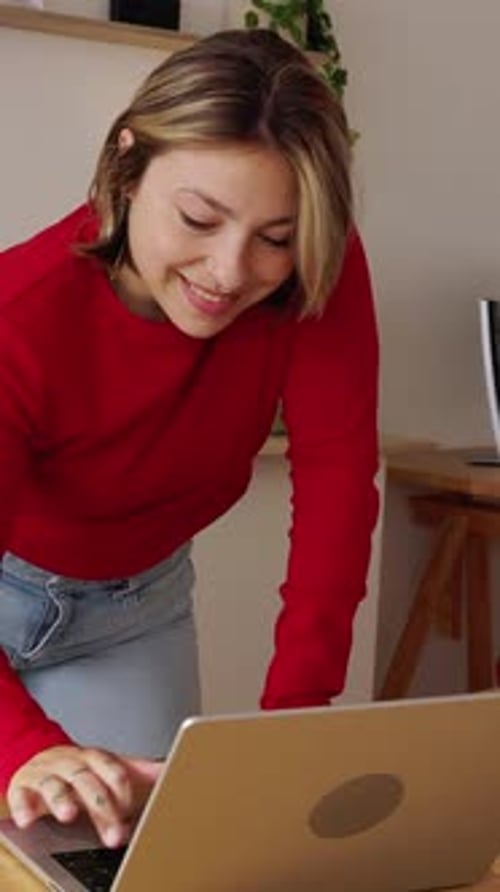 Young Freelancer Woman Working on Laptop in Her Home Office