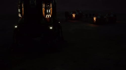 A Mars Colony Base is Illuminated Against the Dark Martian Landscape