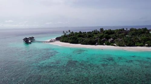 Turquoise Clear Water and Green Island of Maldives