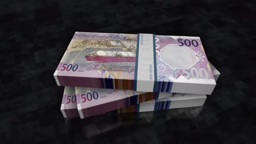 Qatar Riyal money banknote pile packs