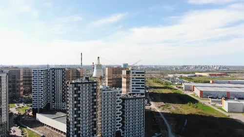 An Aerial View of an Urban Construction Site with Multiple Highrise Buildings in Progress Cranes and