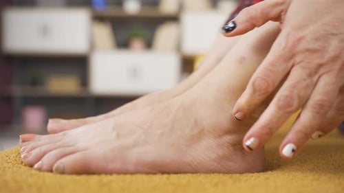 Adult Massaging Bare Foot Ankle Indoors