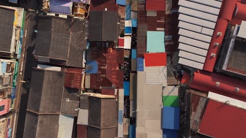 Maeklong Railway Market, a must-visit Bangkok day trip, with vibrant market stalls and moving trains