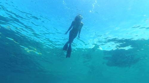 Woman swimming in the ocean