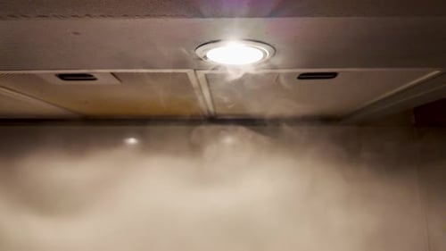 Slow motion of smoke on a kitchen hood