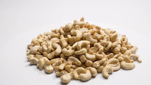 Pile of Cashew Nuts on a White Background