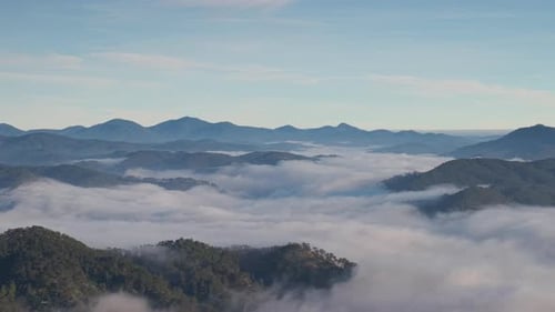Landscape of misty valley and mountain clouds sea