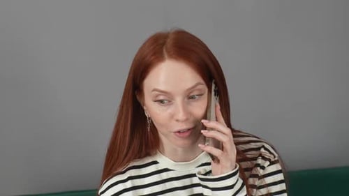 Closeup Face of Positive Pretty Young Woman Talking on Mobile Phone and Smiling Enjoying