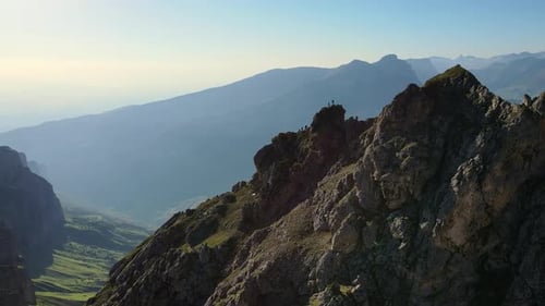 Aerial View of the Climbers Standing on Top of the Mountain