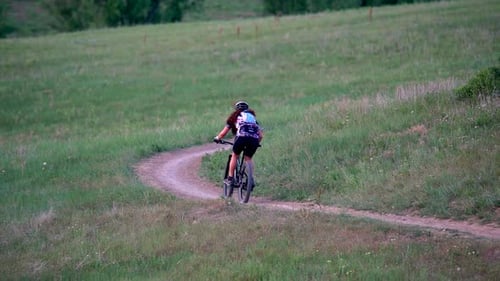 Mountain biker riding in trail in slow motion