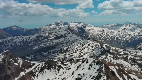 Rocky Snow Mountains Before Sunset Aerial