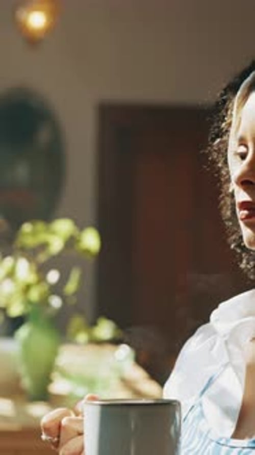 Woman with Curly Hair Drinking from Mug