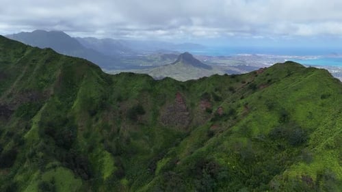 Drone view of Oahu, Hawaii, over tropical lush forest mountains