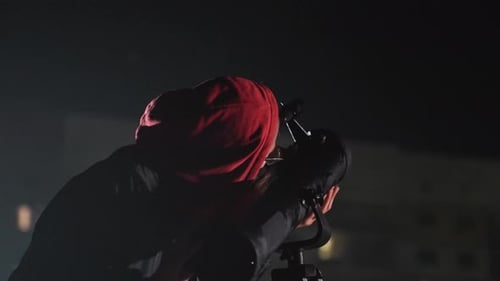 Quiet Night Filled with Sky Exploration and Distant City Lights Calm Individual with Glasses and