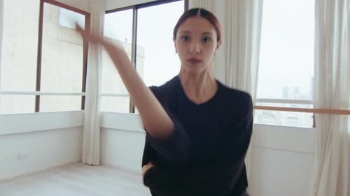 Female Dancer Performing Modern Dance in Studio