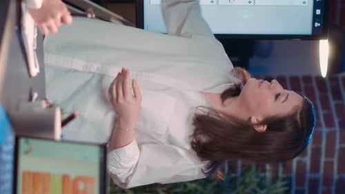 Businesswoman Presenting Data in Modern Office