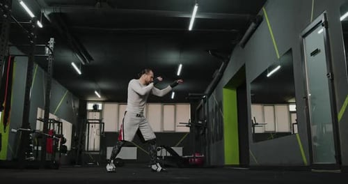 Full Alone Boxer is Working Out in a Gym