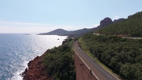 Aerial view of Esterel mountains and coastal train route near Cannes, France