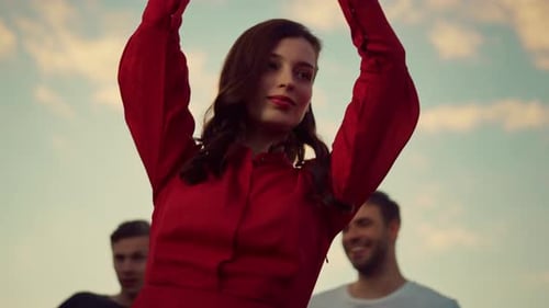 Closeup Pretty Woman Dancing With Friends At Sunset Open Air Disco. Bottom View Fashion Model Enj...