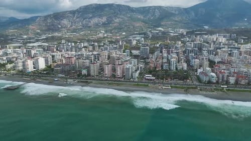 Aerial Video of Coastal Skyline With Rows of Tall Buildings Seaside Promenade and Rolling Green