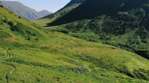 View from the high track in caucasus mountains glaciers, green grass, wild lakes