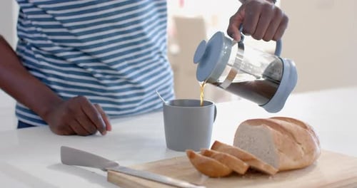 Coffee and bread at kitchen table