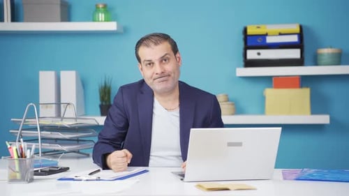 Angry Adult Gesturing at Desk in Office