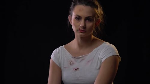 Injured Woman Looking Sadly at Camera