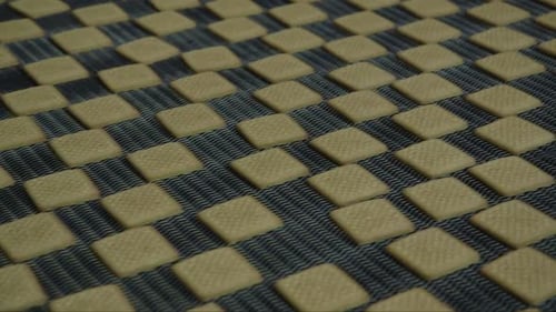 lots of square cookies on the conveyor belt