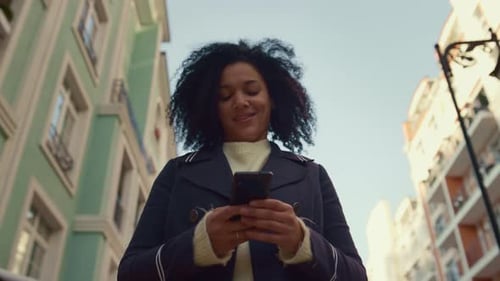 Smiling Woman Holding Smartphone Walking Sunny Morning Closeup. Happy App User. Attractive