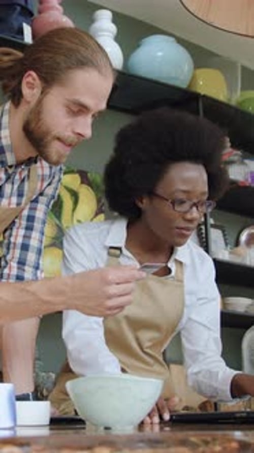 Likable Contented Professional Friendly Multiethnic Sellers of Beautiful Handmade Gift Shop Working