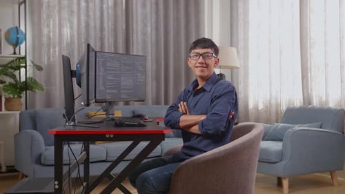 Asian Boy Programmer Smiling And Crossing Her Arms While Creating Software Engineer Developing App