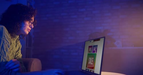 Woman Browses Online Sales on Her Laptop