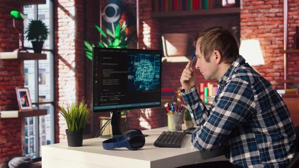 AI Software Developer at Computer Waiting for Code to Finish Compiling ...