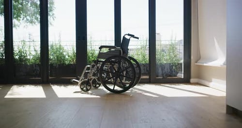 Empty Wheelchair in Bright Room with View