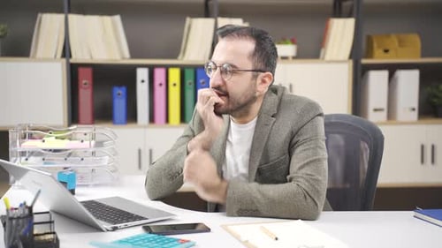 Man Contemplating Business Problems in the Office