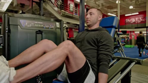 Man train on sports training equipment in a fitness gym