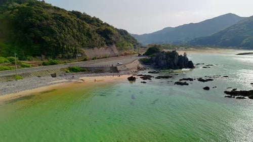 Aerial View of a Scenic Coastal Road and Beach