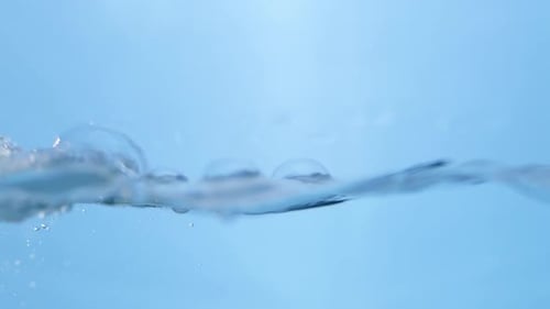 Refreshing Blue Waves. Abstract Water Background with Splashing Bubbles. View of Fresh Water Droplet