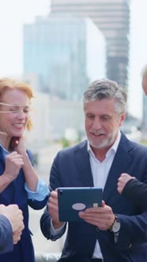 Corporate Team Celebrates Success Using Tablet Technology