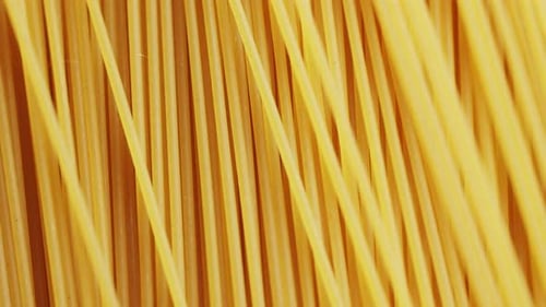 Italian Spaghetti or Noodle Macaroni Pasta Raw Food Background or Texture Close Up