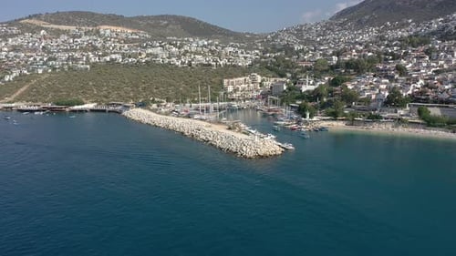 Aerial view of Kalkan town with marina, yachts, houses and streets