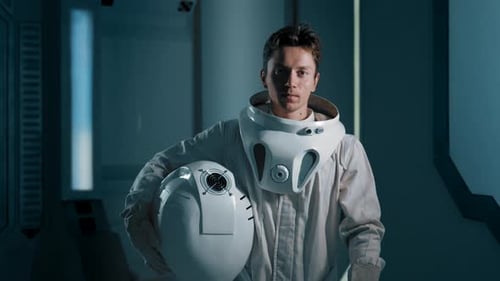 A Man Approaches the Camera in an Astronaut Costume